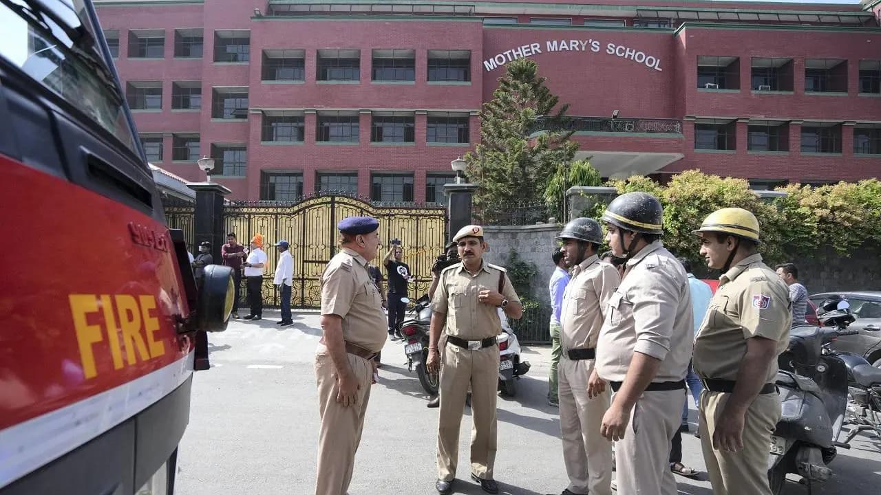 Cops taking charge at the school after getting the threat email. (Credit: PTI)